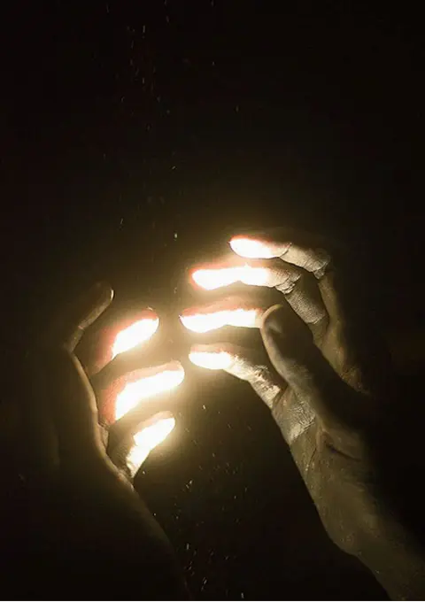 Hands glowing with magical spiritual energy