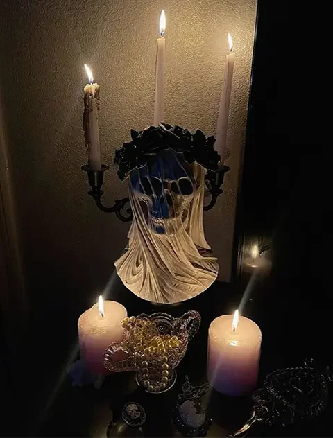 Dark ritual scene with skull and candles representing Lilith spiritual pact witchcraft ritual