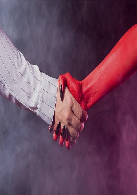 Demon shaking hands with a human as a symbol of pact agreement